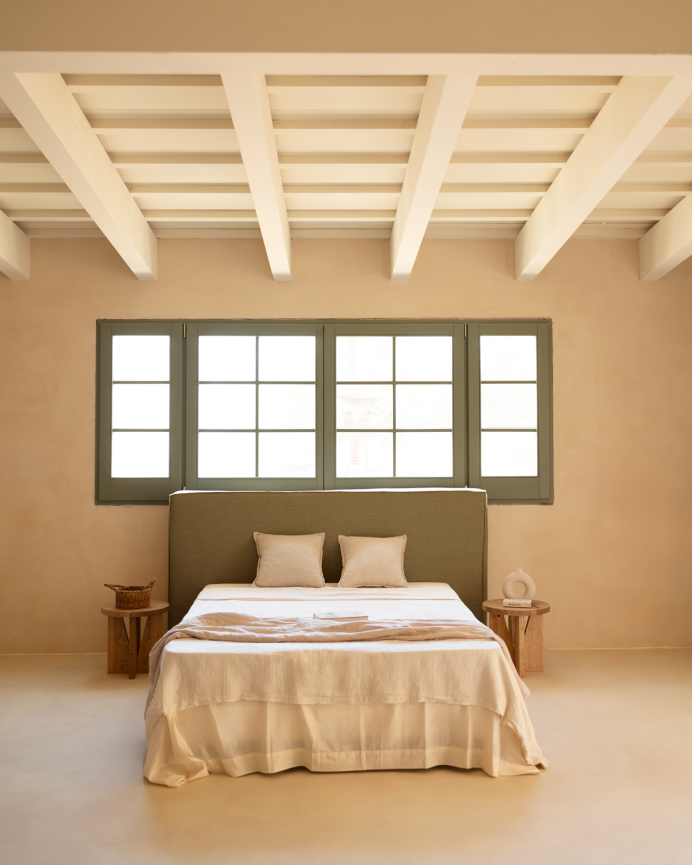 Upholstered headboard in removable green linen in various sizes.