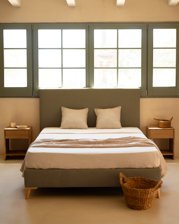 Upholstered linen bed base in green for mattresses of various sizes.
