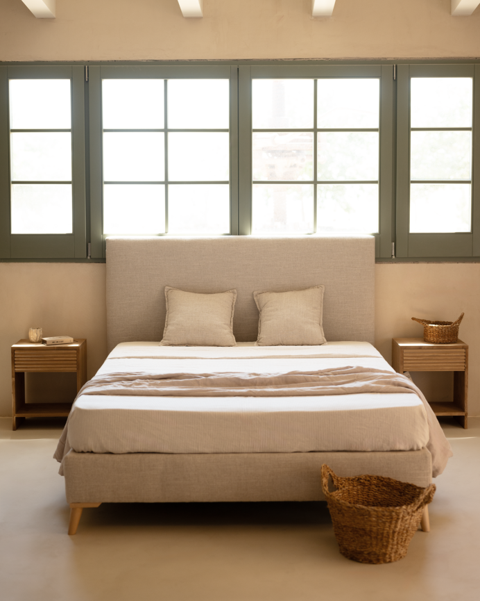 Beige linen upholstered base for mattresses of various sizes.