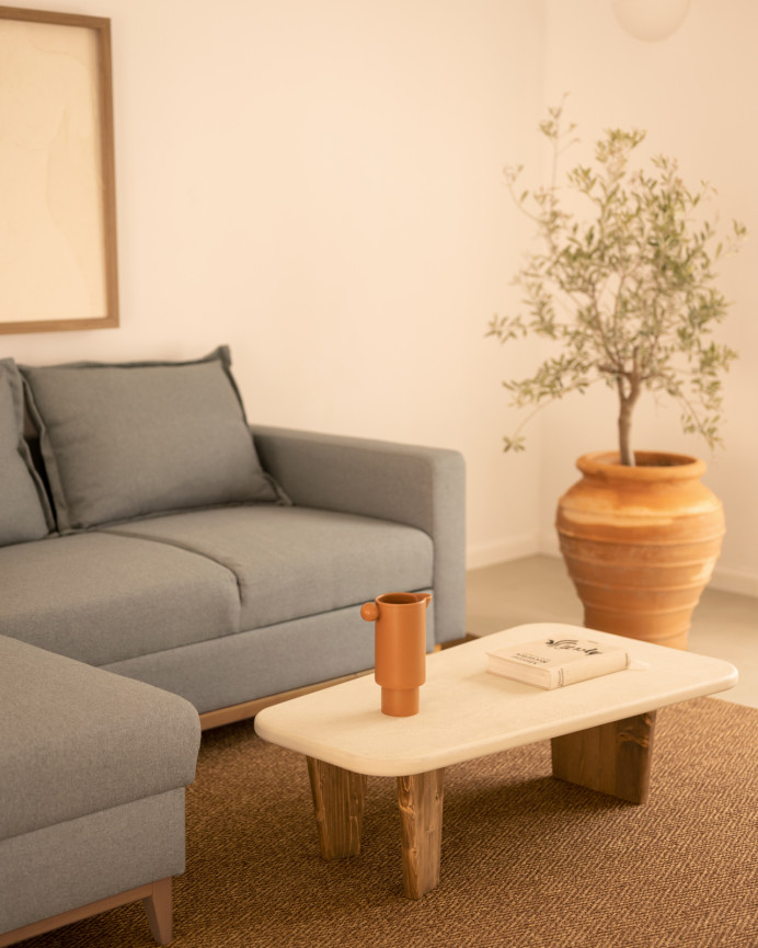Microcement coffee table with three dark oak wood legs measuring 100cm.