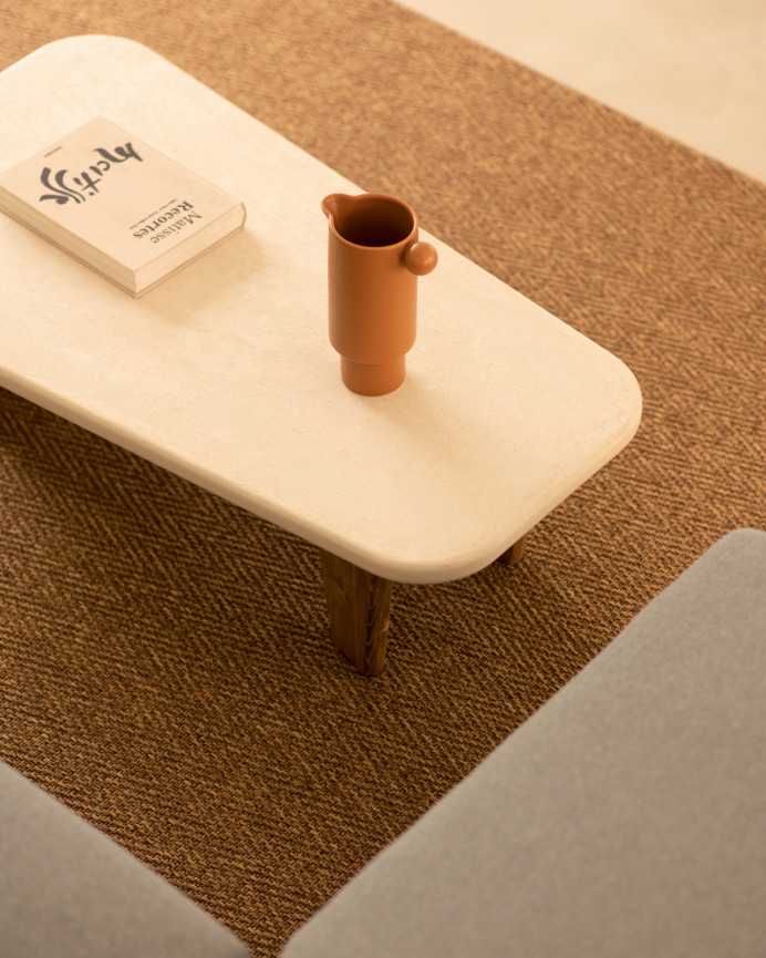 Microcement coffee table with three dark oak wood legs measuring 100cm.