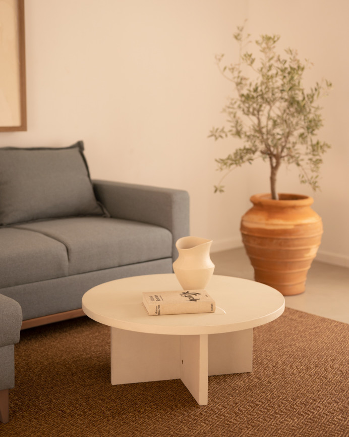 Round microcement coffee table in off-white shade available in various sizes.