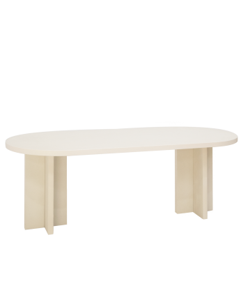 Oval dining table made of microcement in a off-white color, available in various sizes.