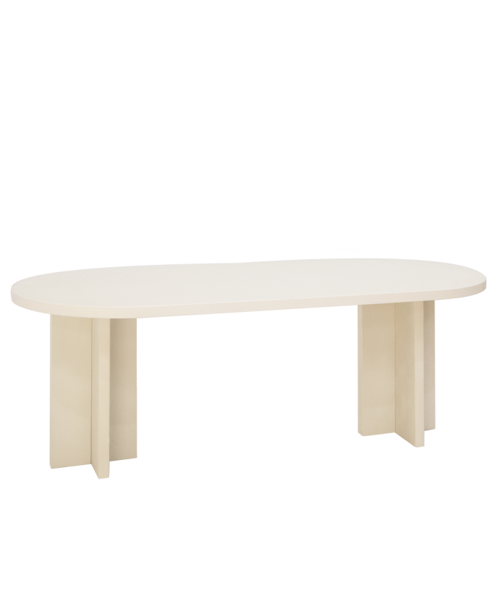Oval dining table made of microcement in a off-white color, available in various sizes.