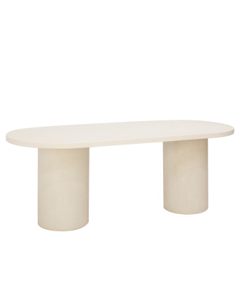 Oval dining table made of micro cement in a light off-white tone, available in various sizes.
