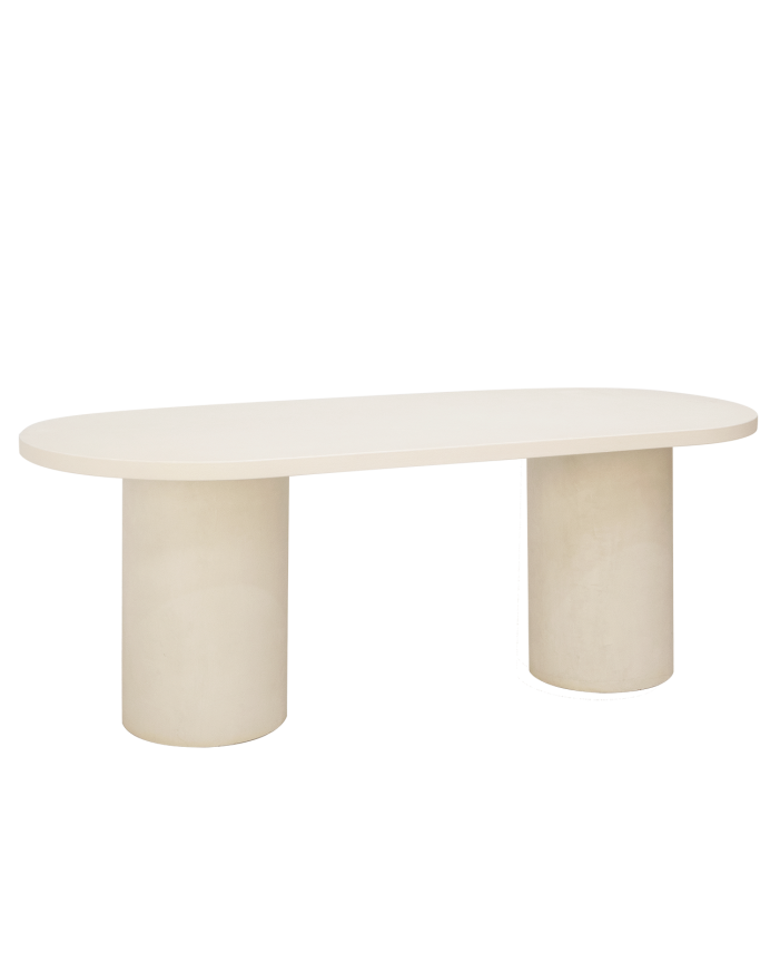 Oval dining table made of micro cement in a light off-white tone, available in various sizes.
