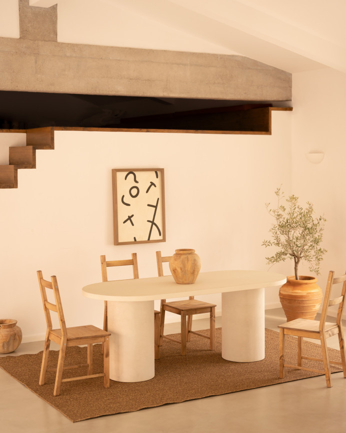 Oval dining table made of micro cement in a light off-white tone, available in various sizes.