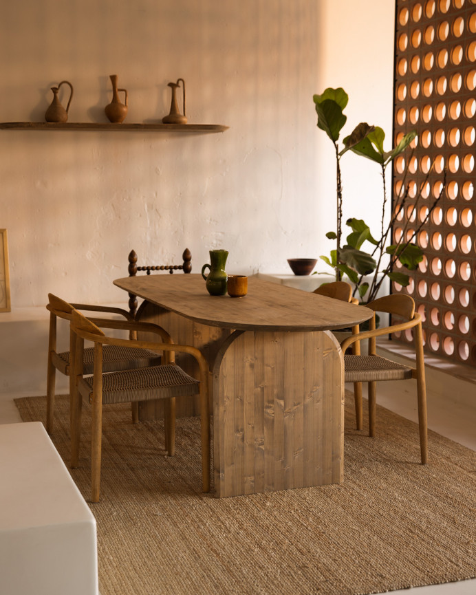 Oval solid wood dining table in dark oak tone of various sizes.