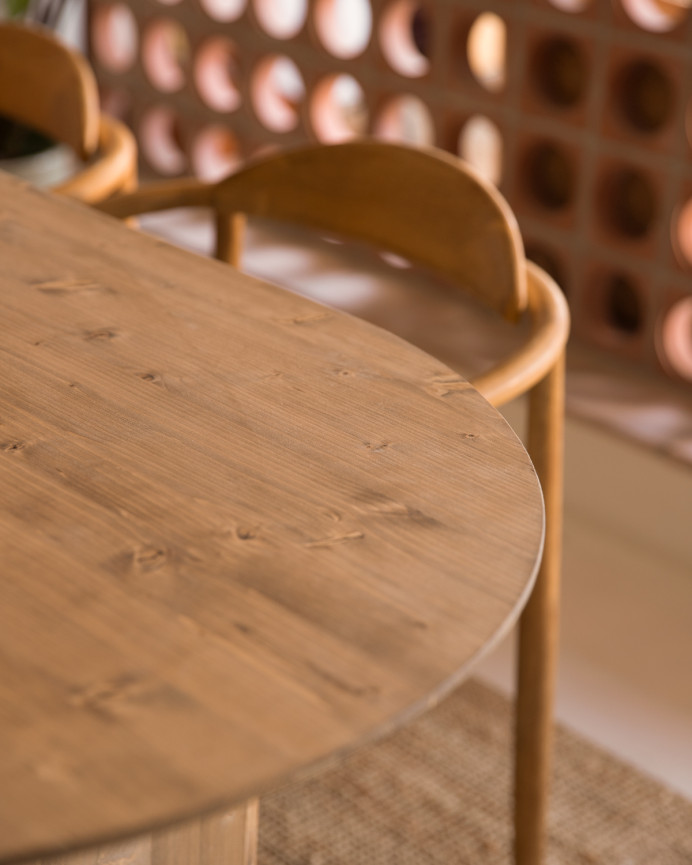 Oval solid wood dining table in dark oak tone of various sizes.