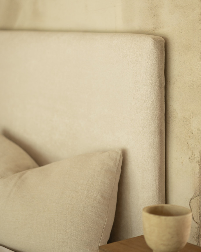 Upholstered headboard in off-white color available in various sizes.