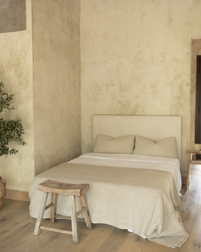 Upholstered headboard in off-white color available in various sizes.