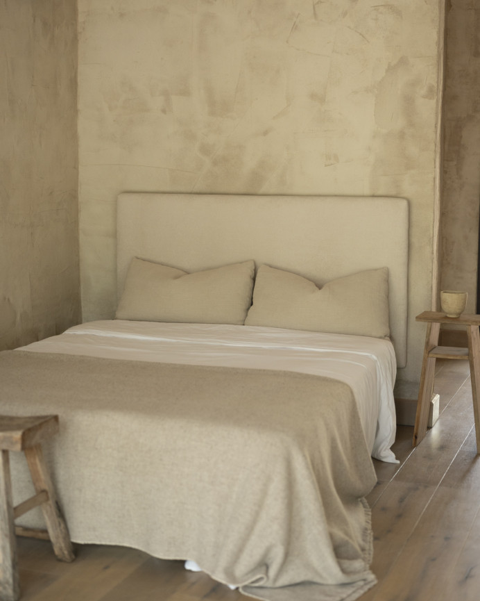 Upholstered headboard in off-white color available in various sizes.