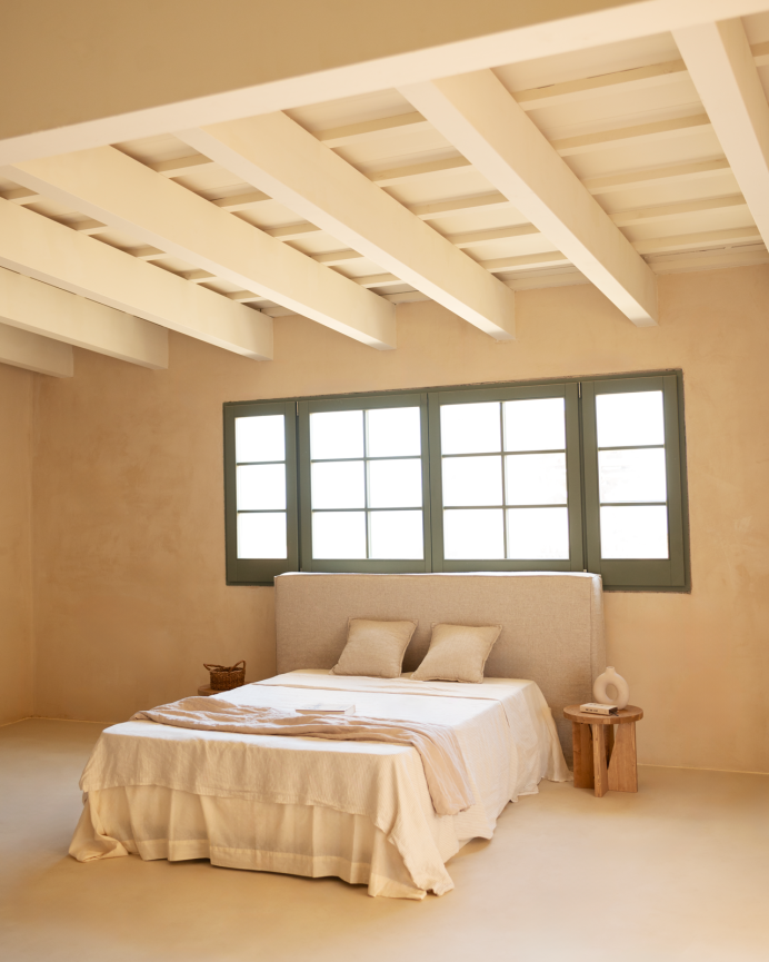 Cover for upholstered headboard with removable beige linen cover in various sizes.