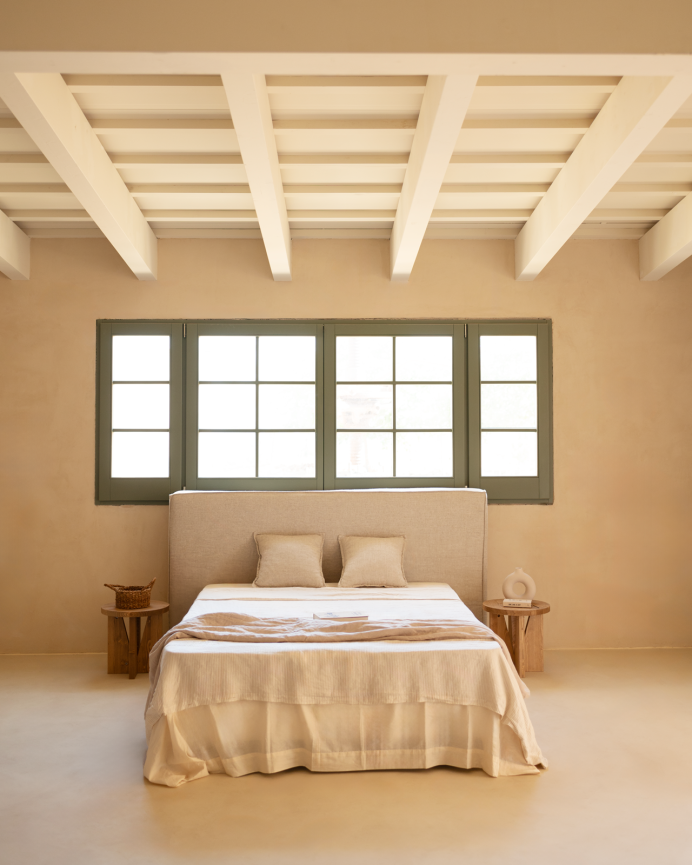 Cover for upholstered headboard with removable beige linen cover in various sizes.