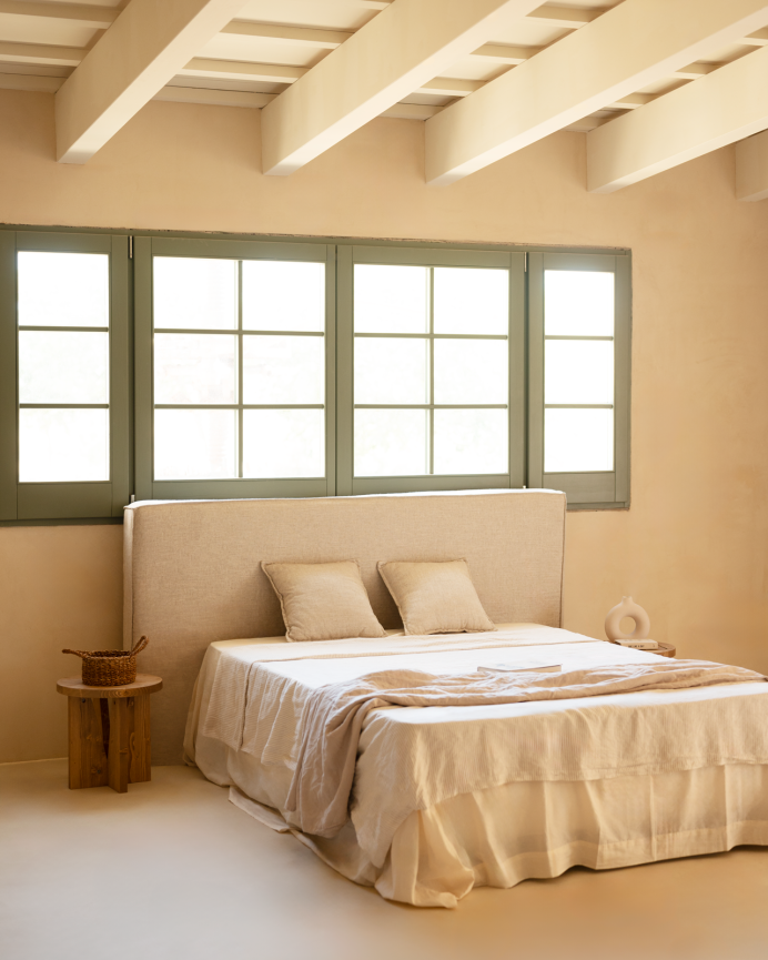 Cover for upholstered headboard with removable beige linen cover in various sizes.