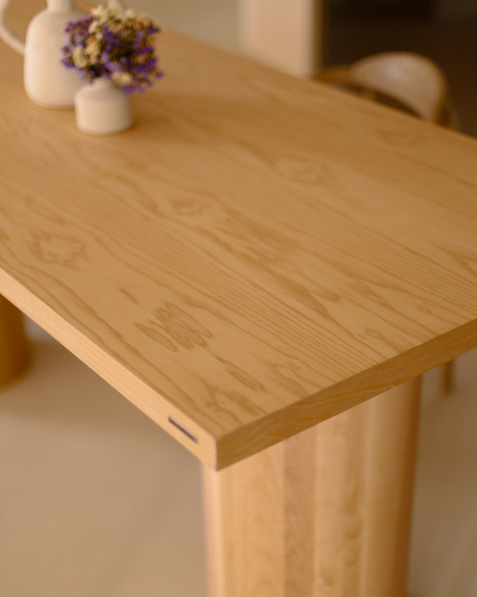 Rectangular ash wood dining table available in various sizes.