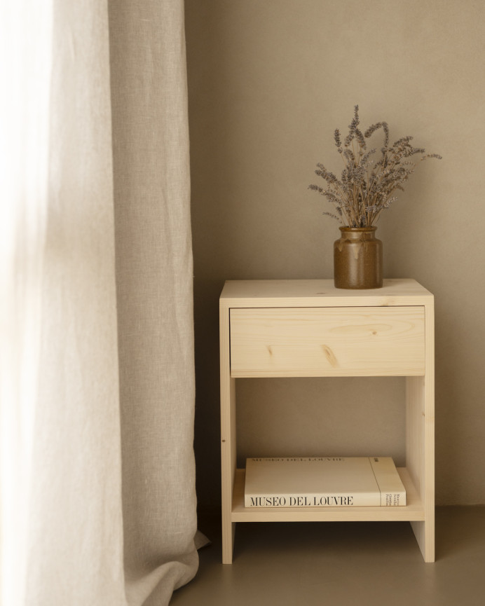 Solid wood bedside table with a natural tone drawer available in various sizes.