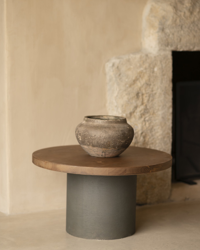 Round solid wood coffee table in dark oak tone with green micro cement leg in various sizes