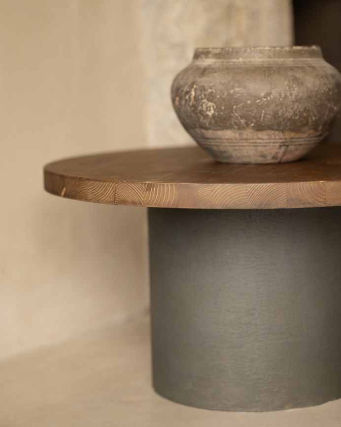 Round solid wood coffee table in dark oak tone with green micro cement leg in various sizes