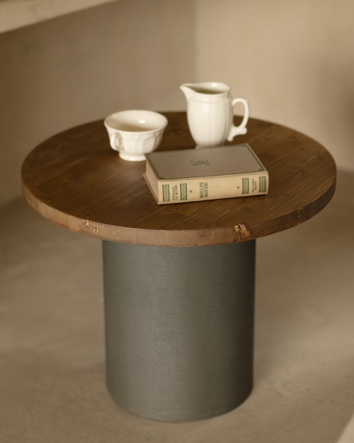 Round solid wood coffee table in dark oak tone with green micro cement leg in various sizes