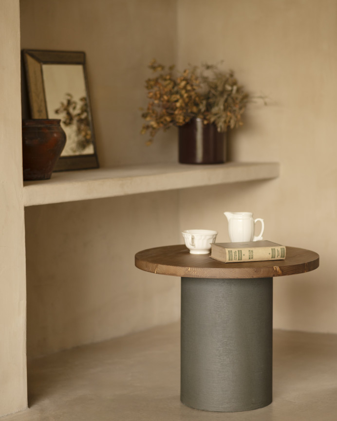 Round solid wood coffee table in dark oak tone with green micro cement leg in various sizes