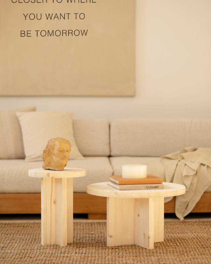 Solid wood stool in natural tone measuring 45x35cm.