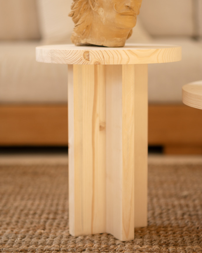 Solid wood stool in natural tone measuring 45x35cm.