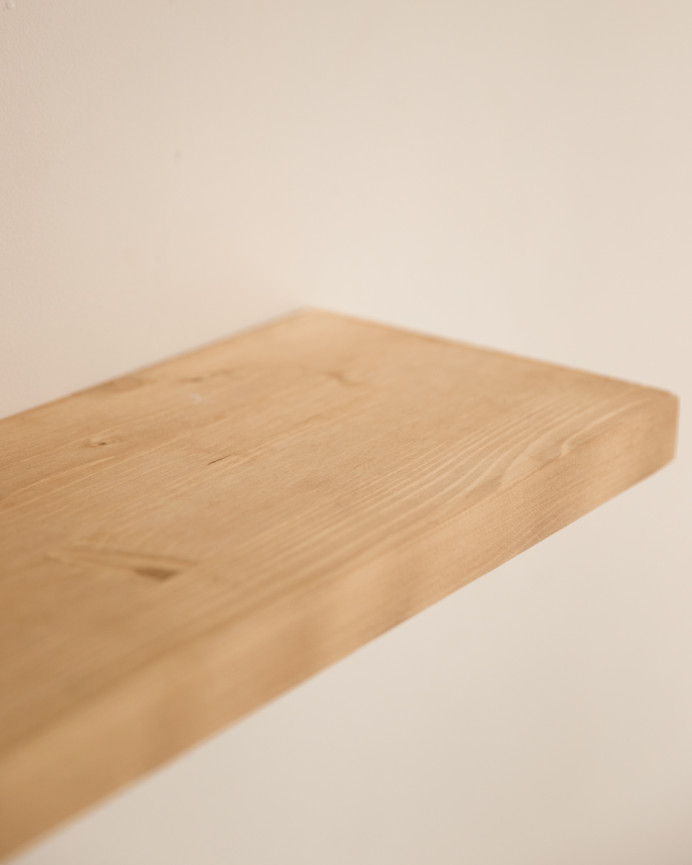 Pack of 3 solid wood floating shelves in medium oak finish, various sizes.