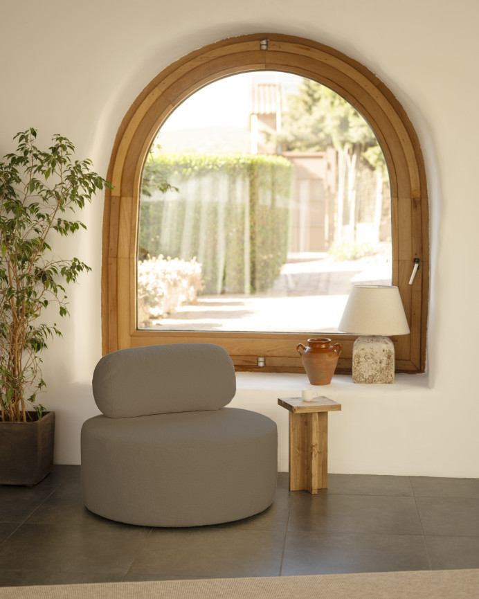 Round brown bouclé armchair measuring 91x71cm.