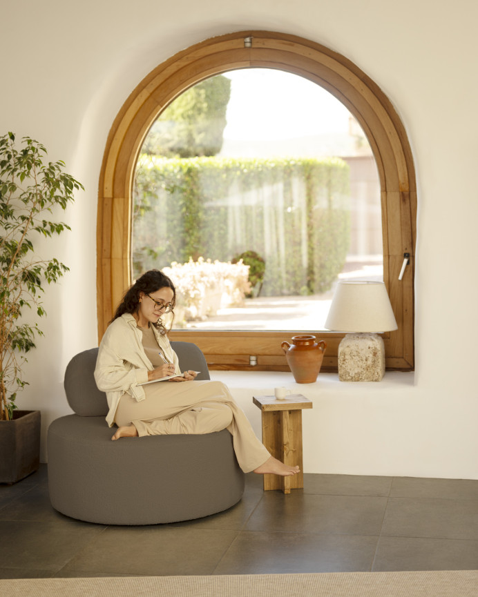 Round brown bouclé armchair measuring 91x71cm.