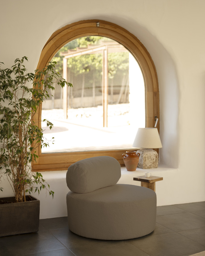 Round brown bouclé armchair measuring 91x71cm.