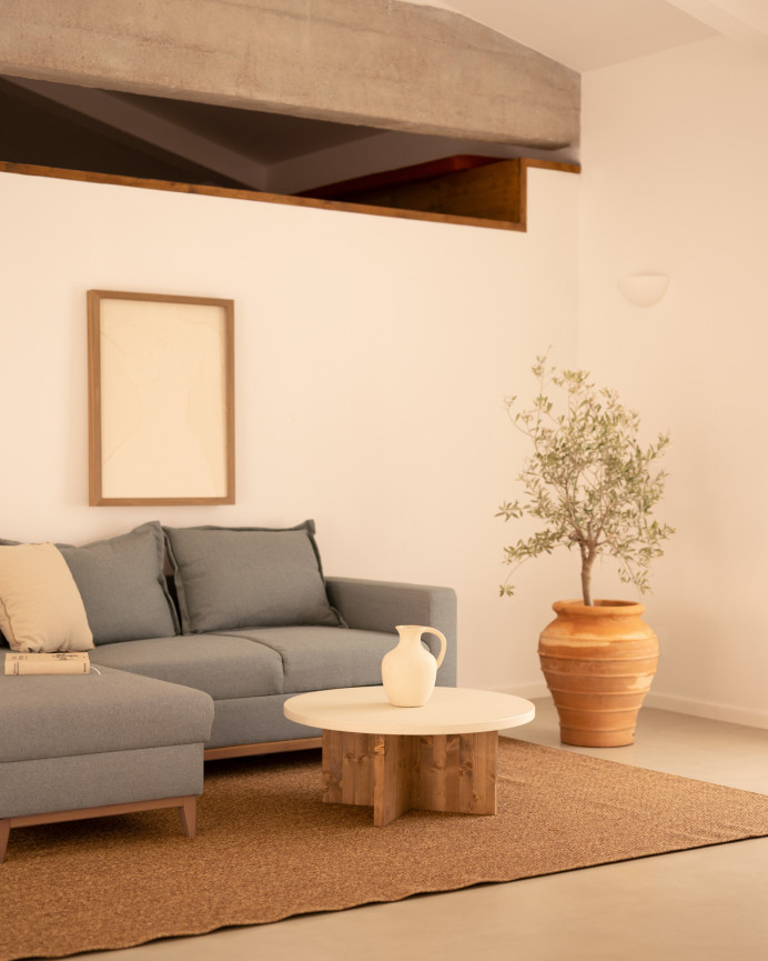 Round microcement coffee table in off-white tone with dark oak wood legs in various sizes.