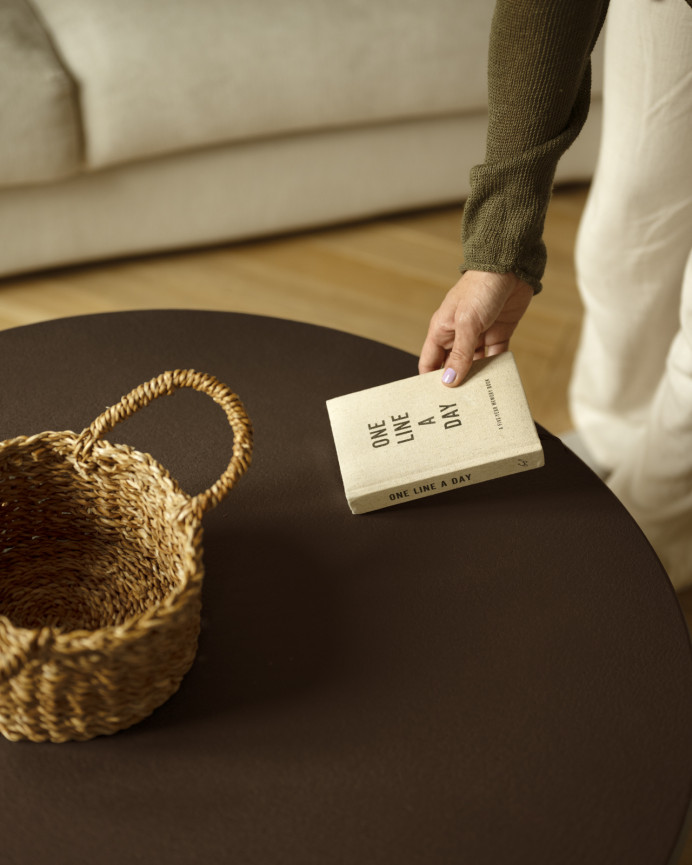 Round brown microcement side table measuring 45x50cm