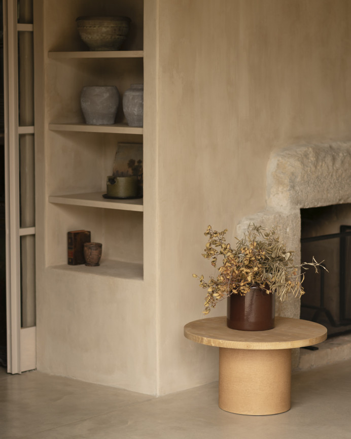 Round solid wood coffee table in a medium oak tone and terracotta microcement leg in various sizes.