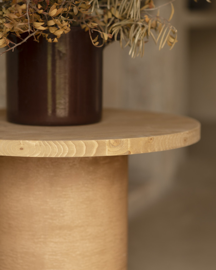 Round solid wood coffee table in a medium oak tone and terracotta microcement leg in various sizes.
