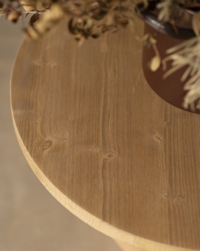 Round solid wood coffee table in a medium oak tone and terracotta microcement leg in various sizes.