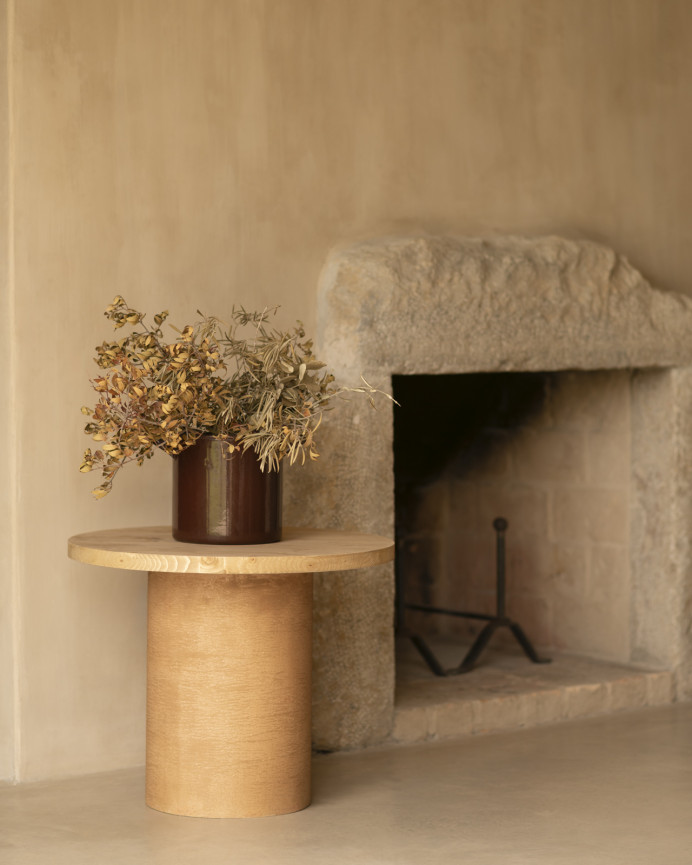 Round solid wood coffee table in a medium oak tone and terracotta microcement leg in various sizes.