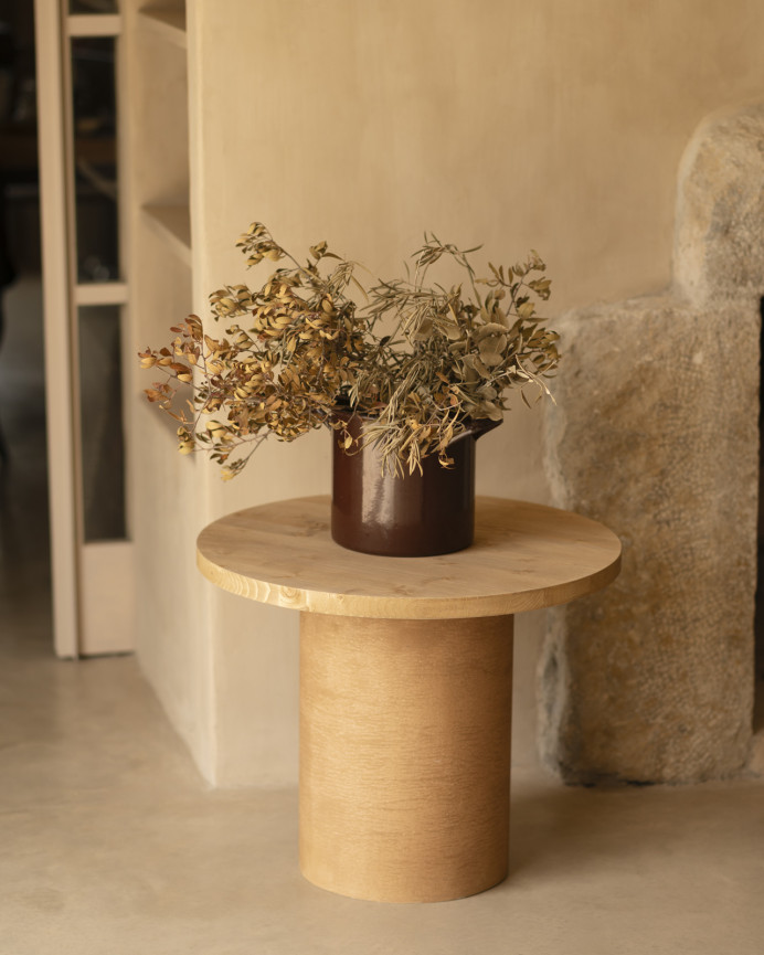 Round solid wood coffee table in a medium oak tone and terracotta microcement leg in various sizes.