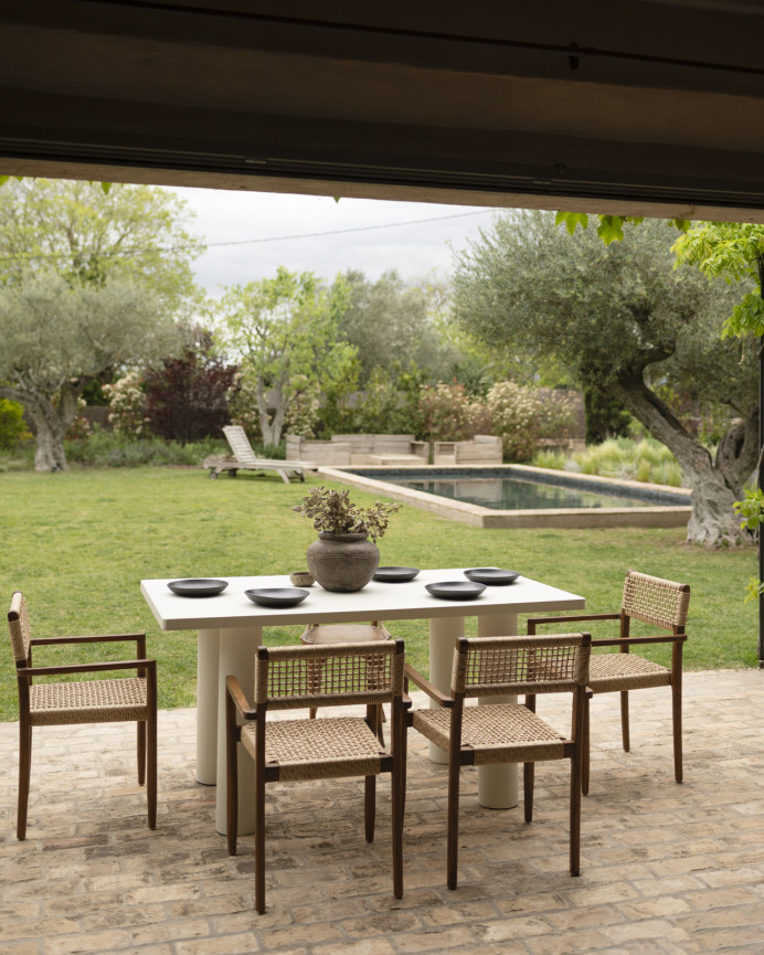 Rectangular dining table made of microcement in an off-white tone, available in various sizes.