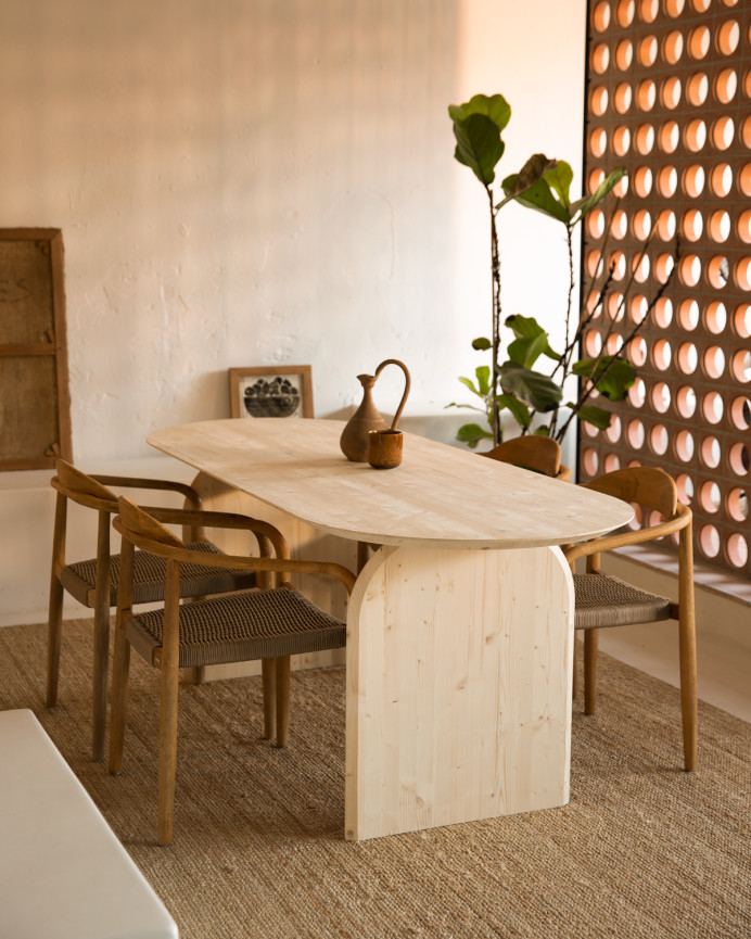 Oval solid wood dining table in natural tone in various sizes.