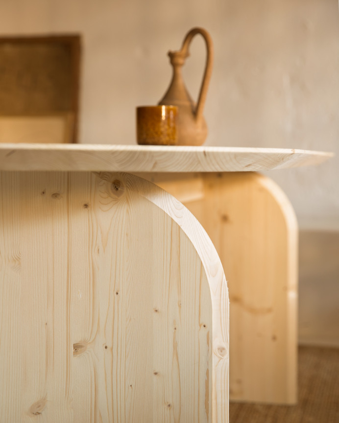 Oval solid wood dining table in natural tone in various sizes.