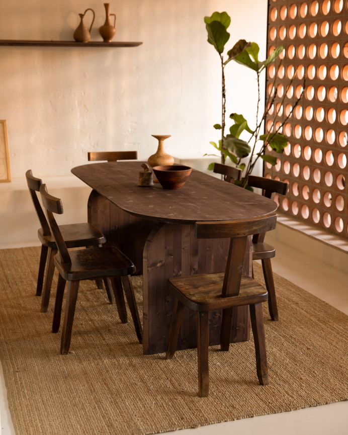 Oval solid wood dining table in walnut tone, available in various sizes.