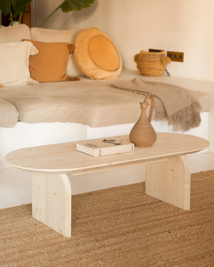 Oval solid wood coffee table in natural tone available in various sizes.