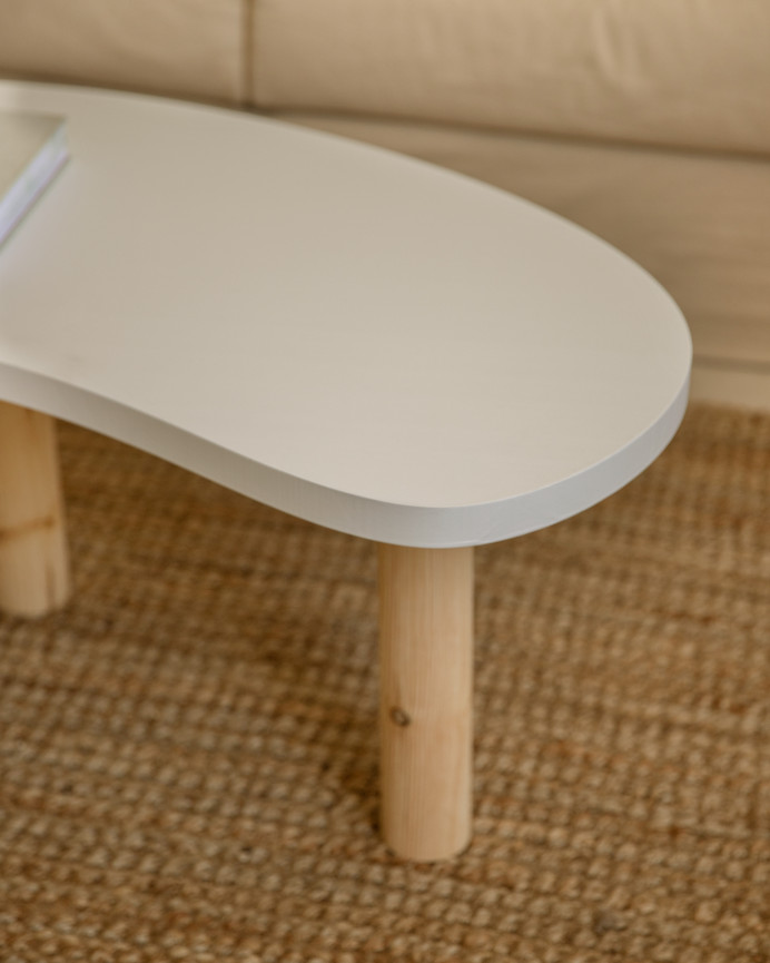 Solid wood organic-shaped coffee table in white tone with natural tone legs of various sizes