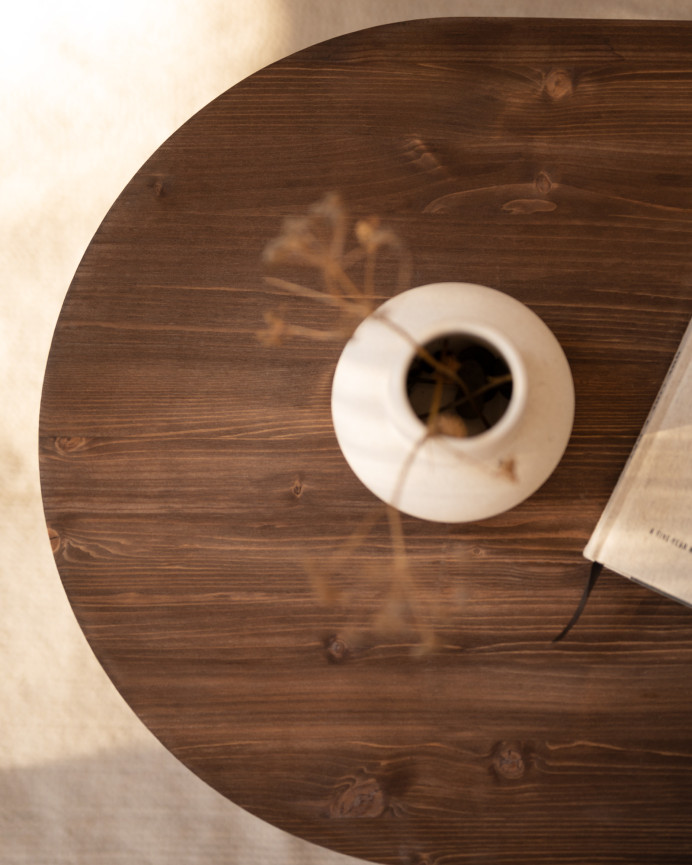 Solid wood walnut tone coffee table measuring 120x50cm.