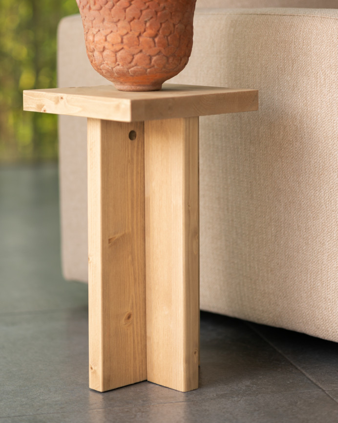 Solid wood side table in a medium oak tone measuring 25x25cm.