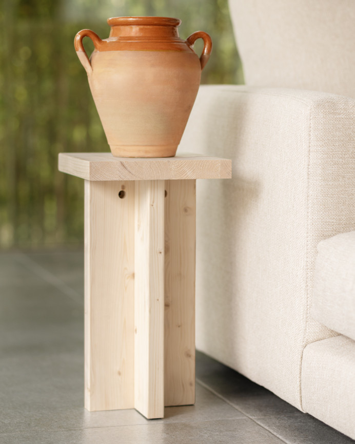 Solid wood side table in natural tone measuring 25x25cm.