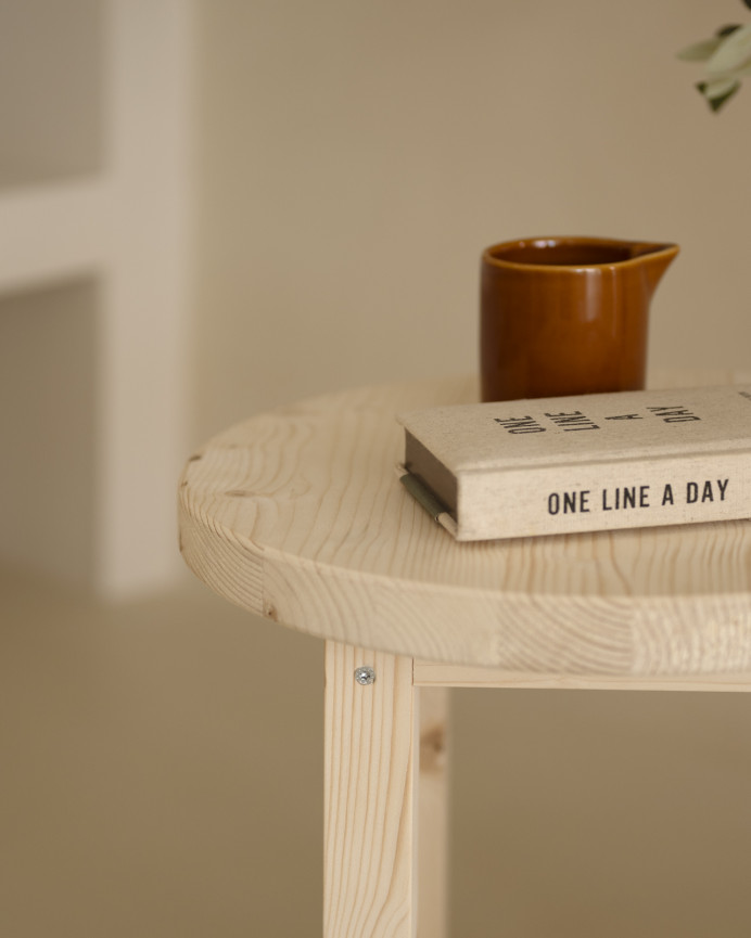 Solid wood bedside table in a natural tone measuring 40x35cm.