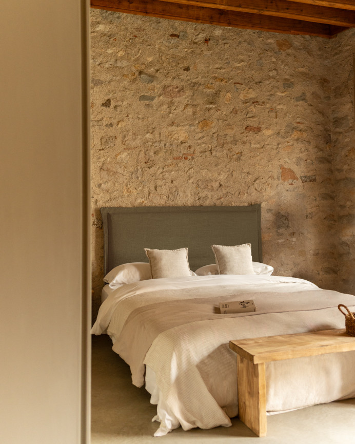Upholstered green linen headboard with removable cover, available in various sizes.