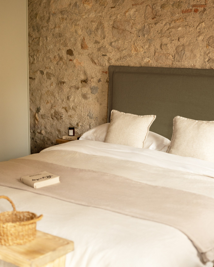 Upholstered green linen headboard with removable cover, available in various sizes.